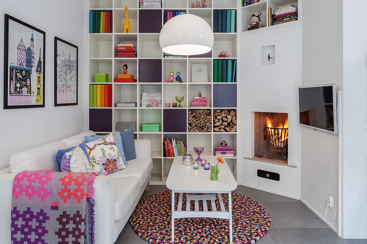 Everything from the eye-catching rug to the books on the shelves and cozy throws bring color to this home library