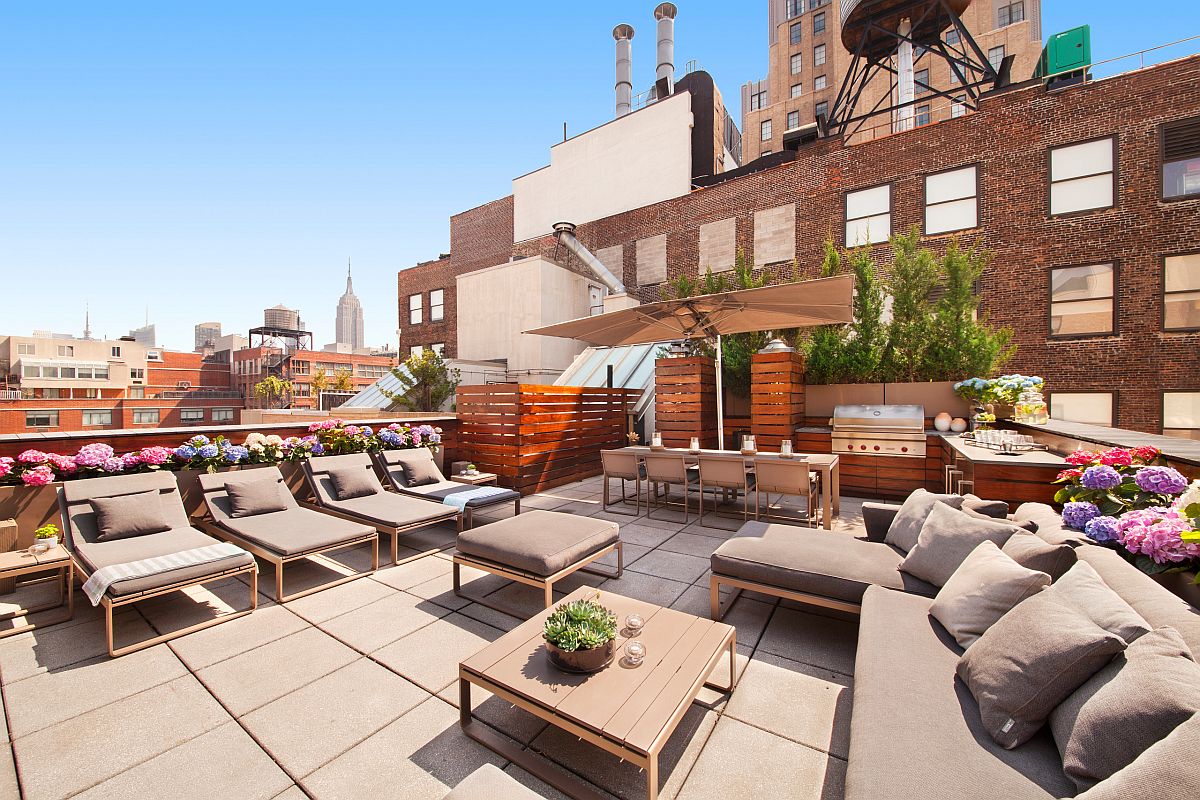 Expansive rooftop hangout of New York home with a fabulous contemporary kitchen and ample seating