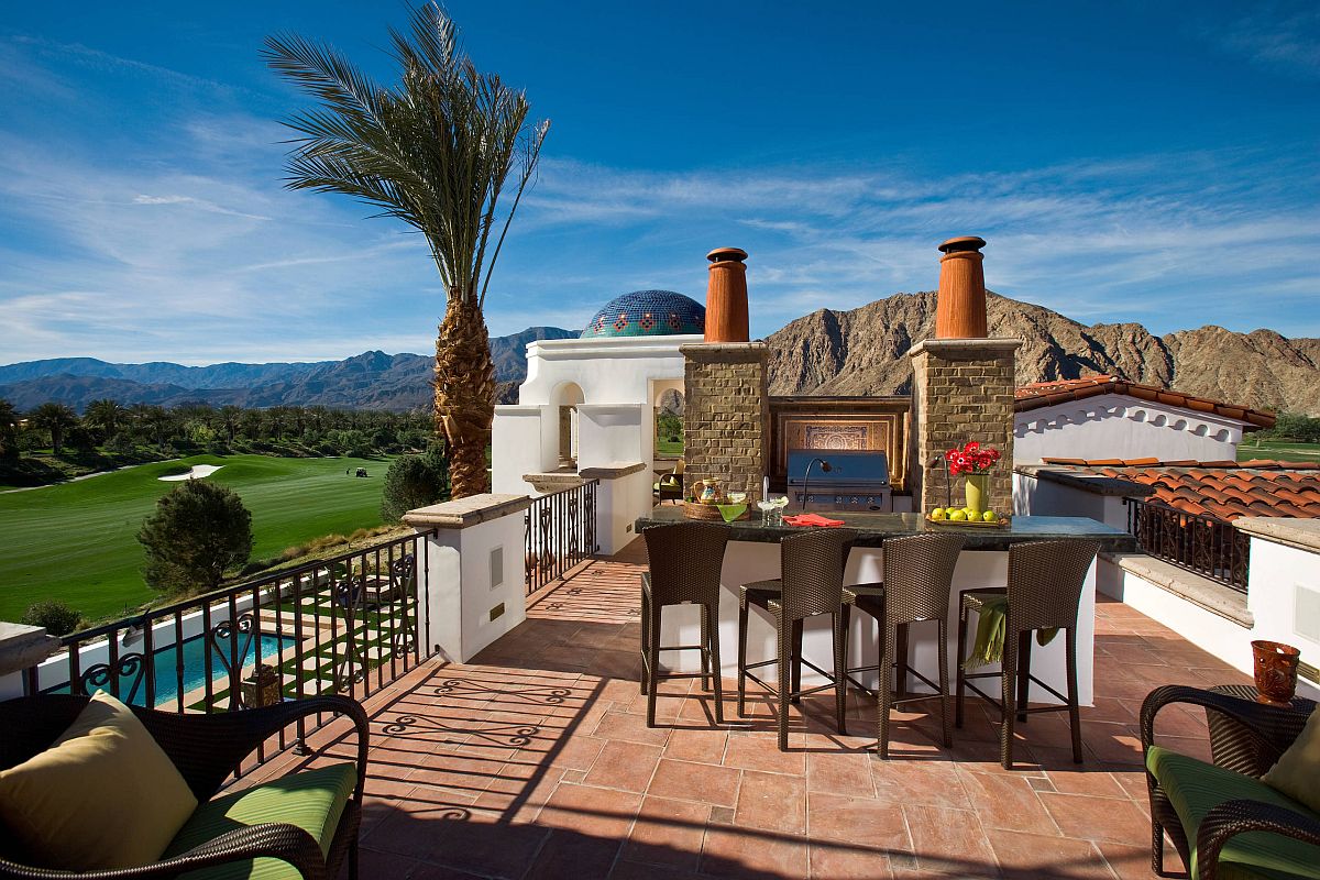 Expansive rooftop kitchen of lavish Mediterranean home with a view to match its splendor