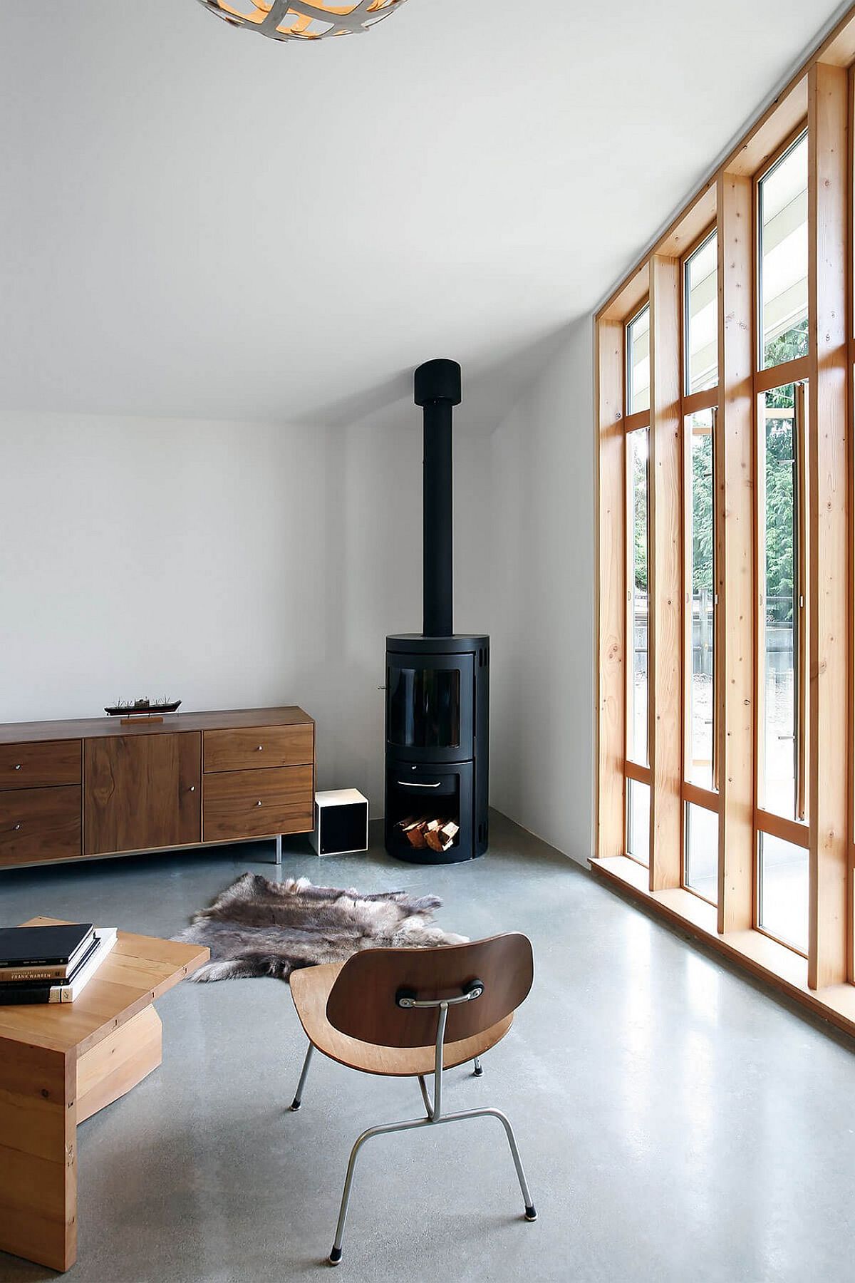 Fireplace in the corner and smart credenza fill the corner of the studio space