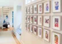 Framed-personal-photographs-used-to-decorate-the-white-becah-style-hallway-28010-217x155