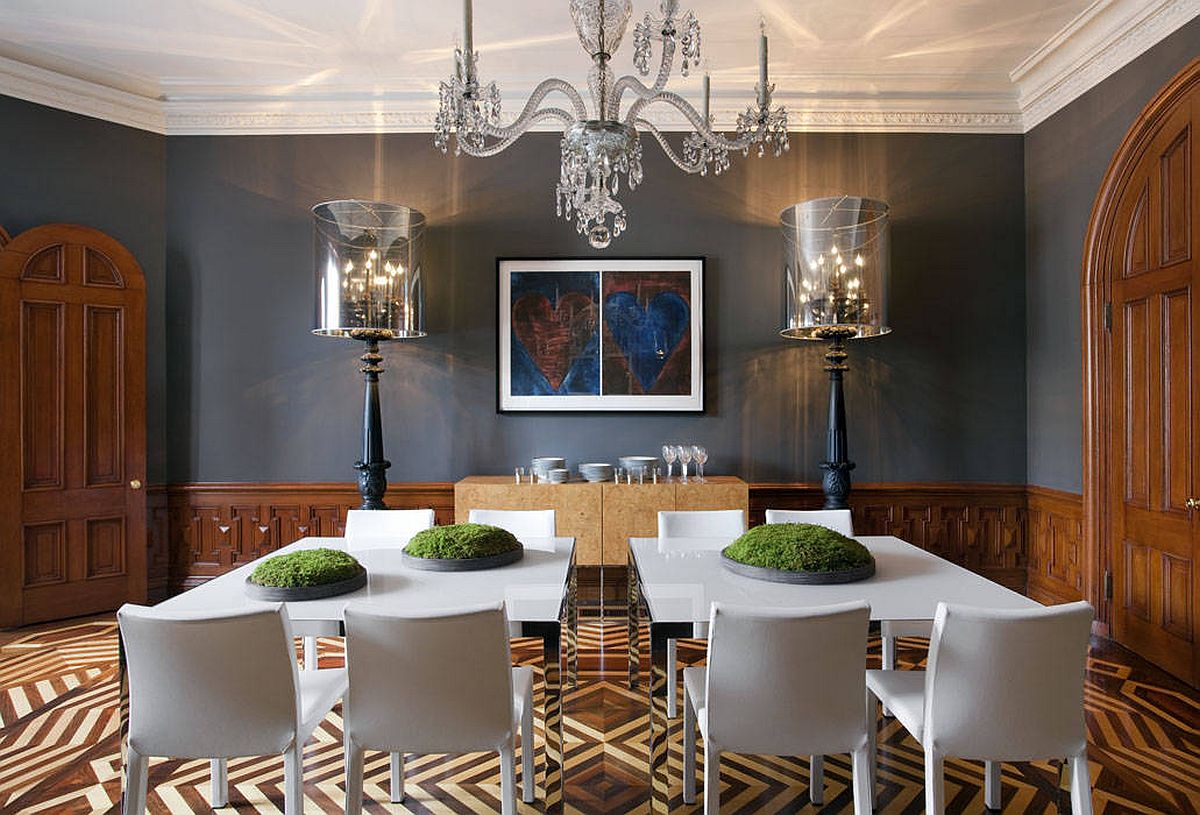 Furniture and the dark gray backdrop add minimal style to this spacious contemporary dining room