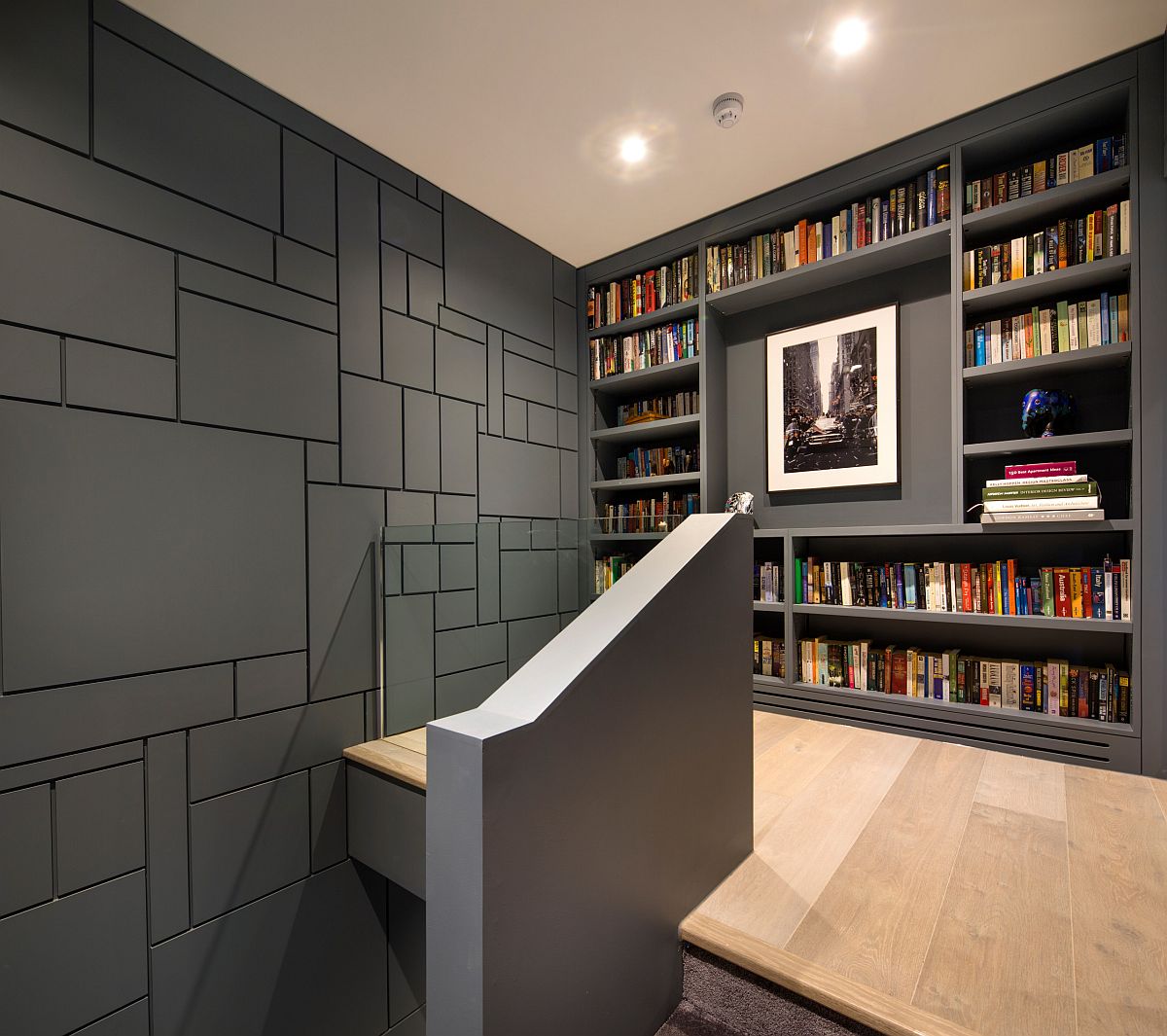 Gorgeous gray walls add to the sophisticated style of this modern bookshelf