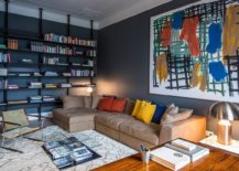 Gorgeous-home-library-with-deep-gray-walls-still-feels-cheerful-thanks-to-the-colorful-wall-art-and-accent-pillows-97824-217x155