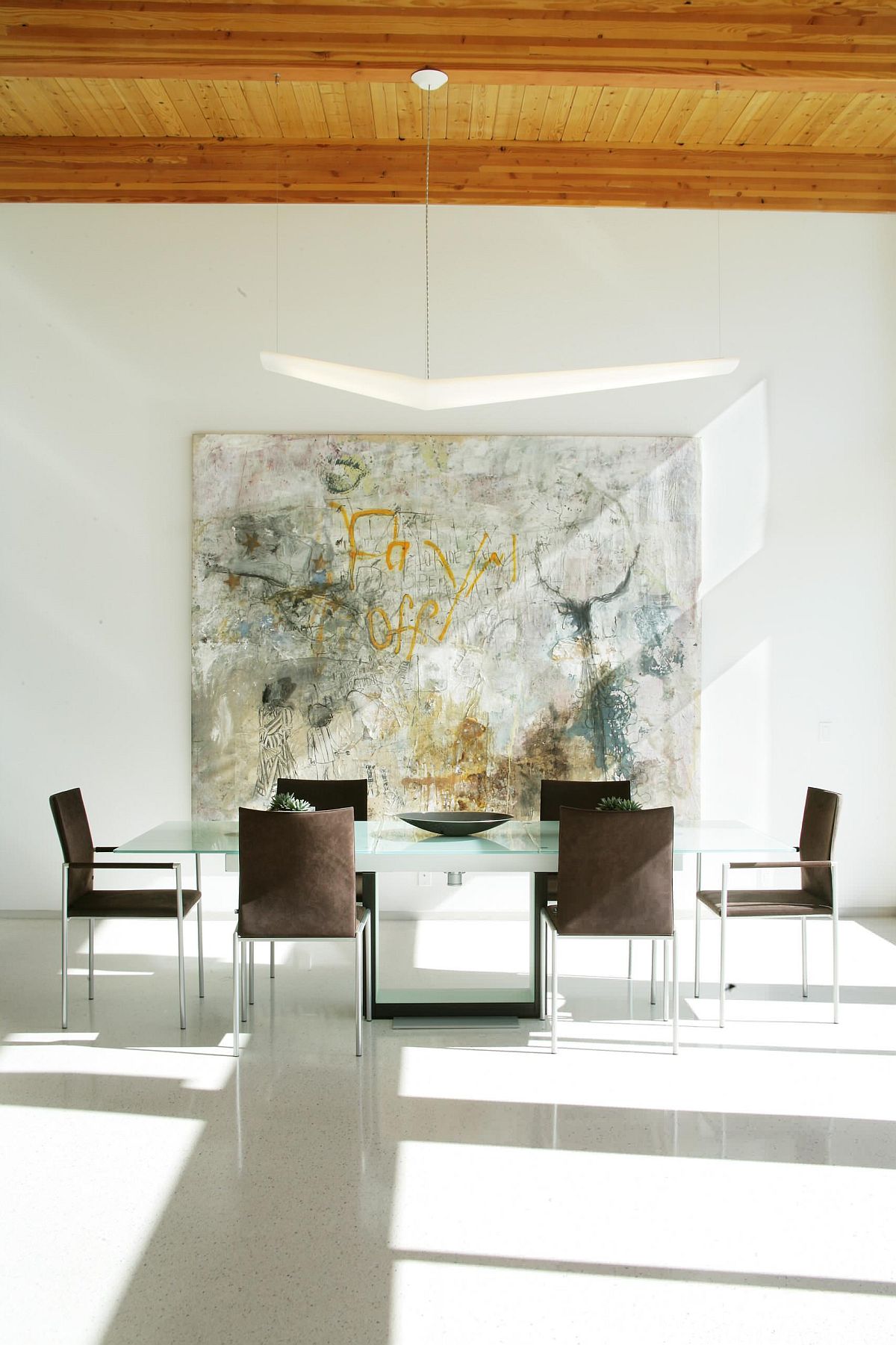 Graffiti brought into the minimal dining room to create more visual interest