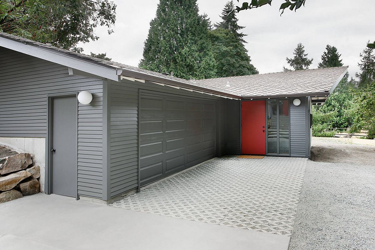 Gray gives the exterior a modern appeal with red doors providing visual contrast