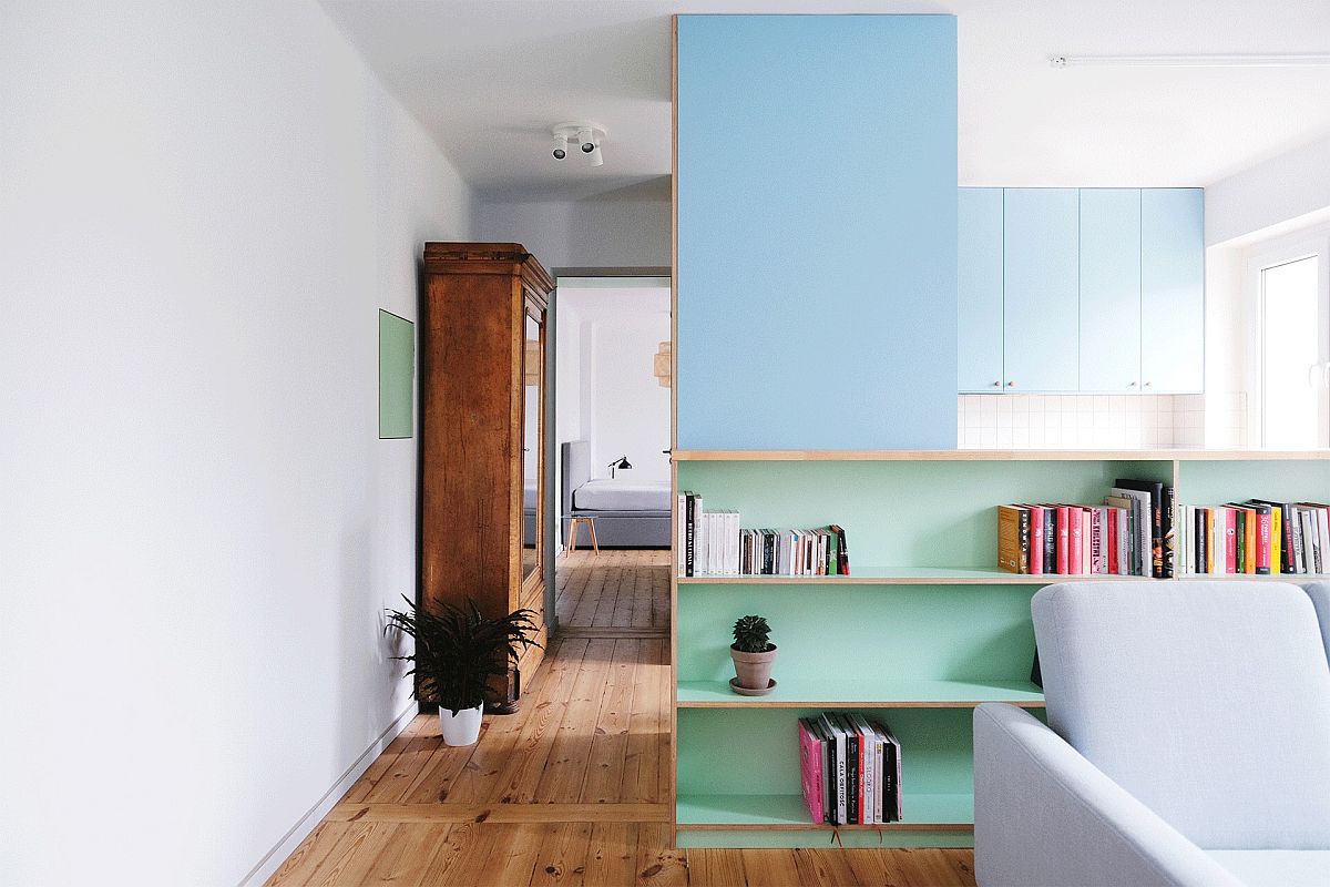 Hallway, kitchen and bedroom of the apartment viewed from the entry