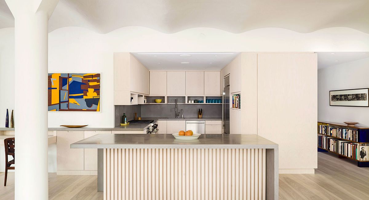 Large niche inside the apartment contains the space-savvy and stylish modern kitchen