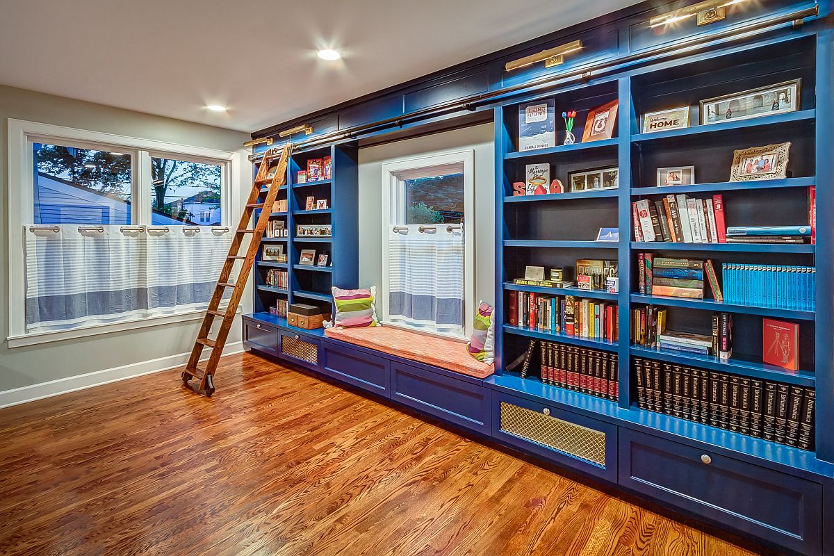 Lovely custom built-in bookshelves in blue for the modest home library