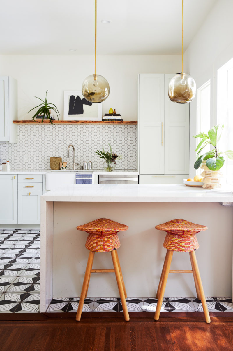 Modern kitchen with black and white patterned floor tile