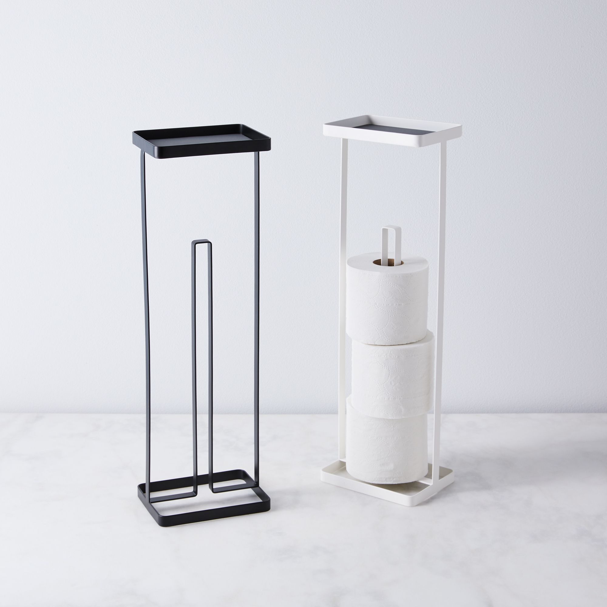 Modern toilet paper stands in black and white