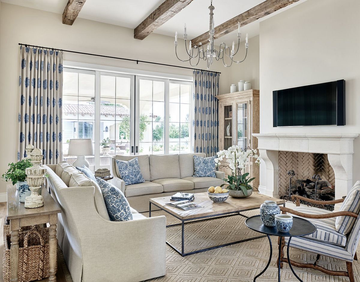 Modern traditional living room of the revamped home in white with gorgeous blue accents