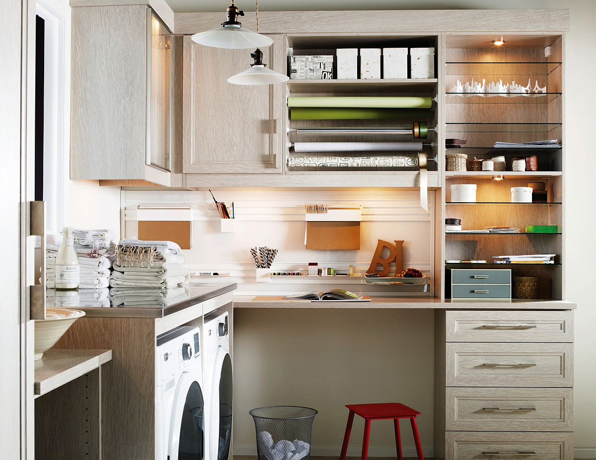 Multiple storage units, cabinets and shelves along with smart lighting create this exquisite little crafts room