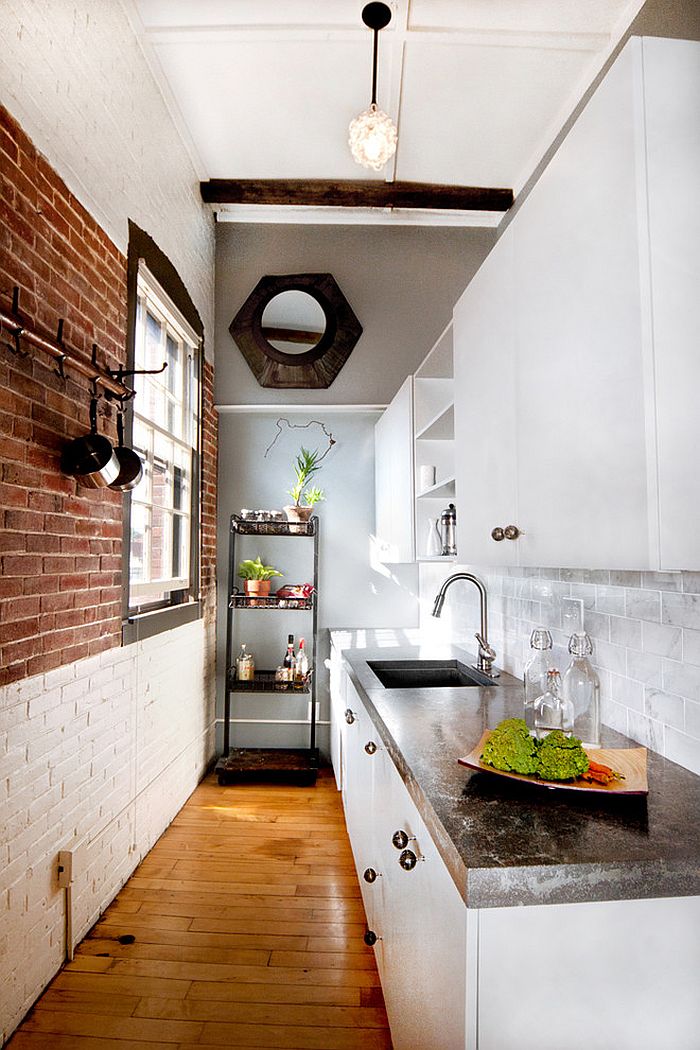 Narrow kitchen with modern-industrial style witch brich wall that is half whitewashed on one side