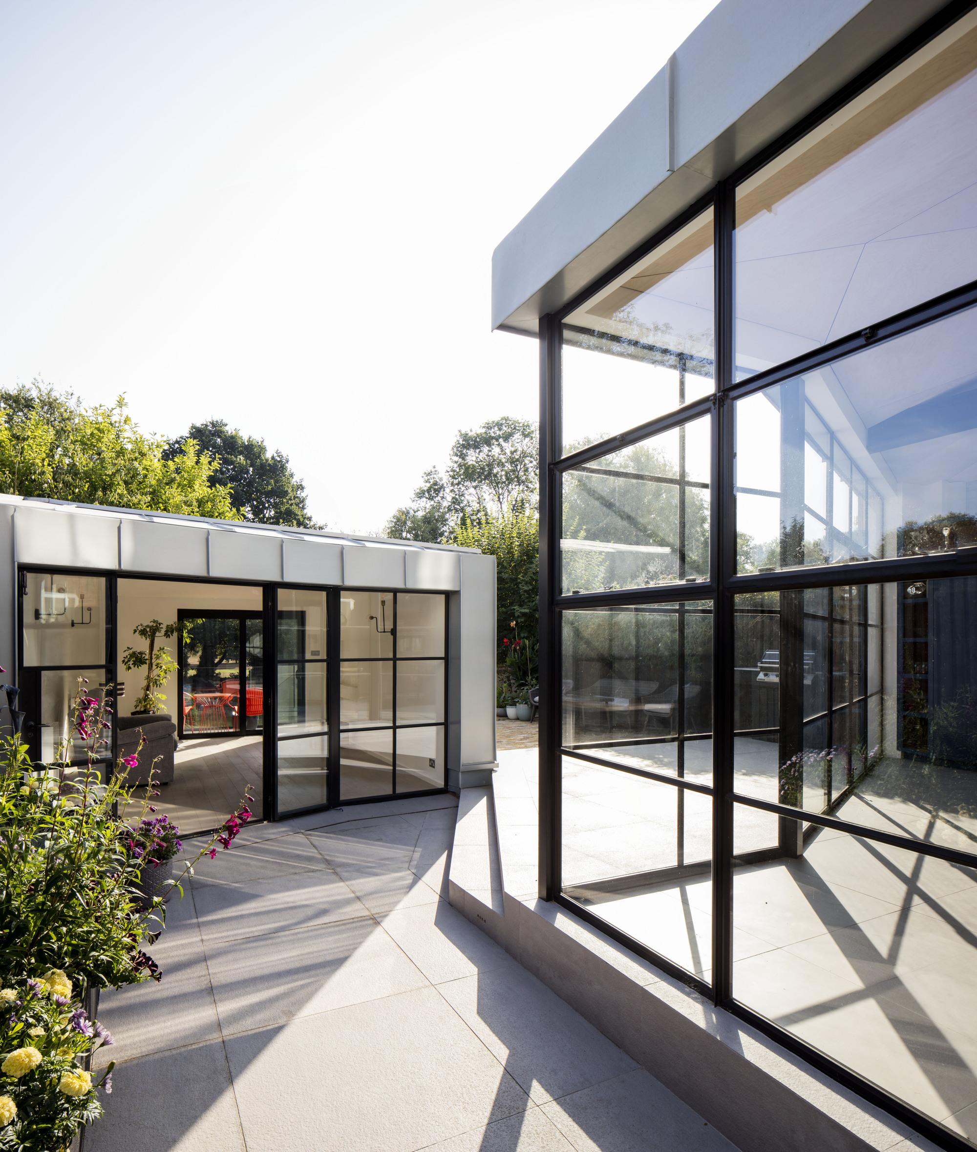 New rear extension and garden room of the house with glass walls and ample natural light