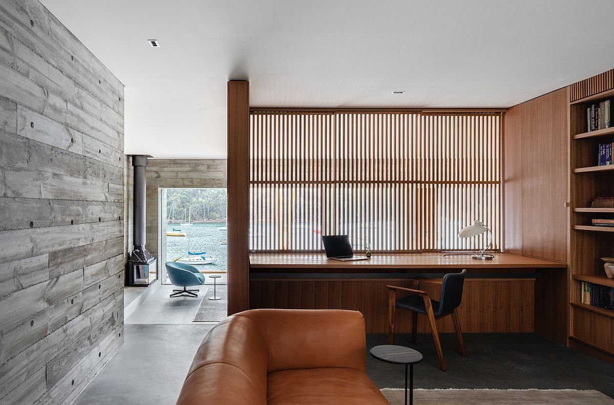 Partition with wooden slats fliters light into the modern home office