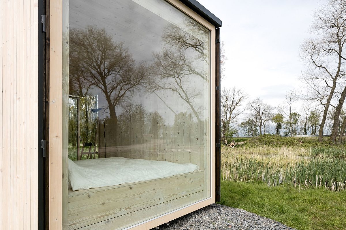 Picture-perfect window connects the bedroom with the landscape outside