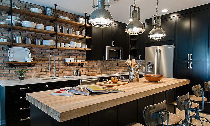 Reclaimed brick wall backdrop of the kitchen gives it a gorgeous industrial charm