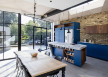 Renovated-Victorian-home-dining-area-and-kitchen-with-exposed-brick-wall-and-blue-cabinets-75480-217x155