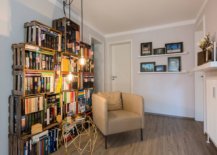 Repurposed-wooden-crates-have-been-used-to-create-a-custom-bookshelf-in-this-small-home-library-51313-217x155