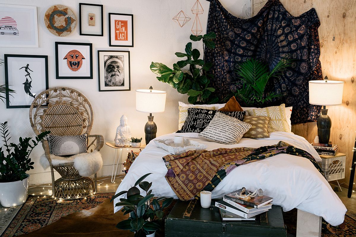 Bohemian bedroom with lights and artwork.