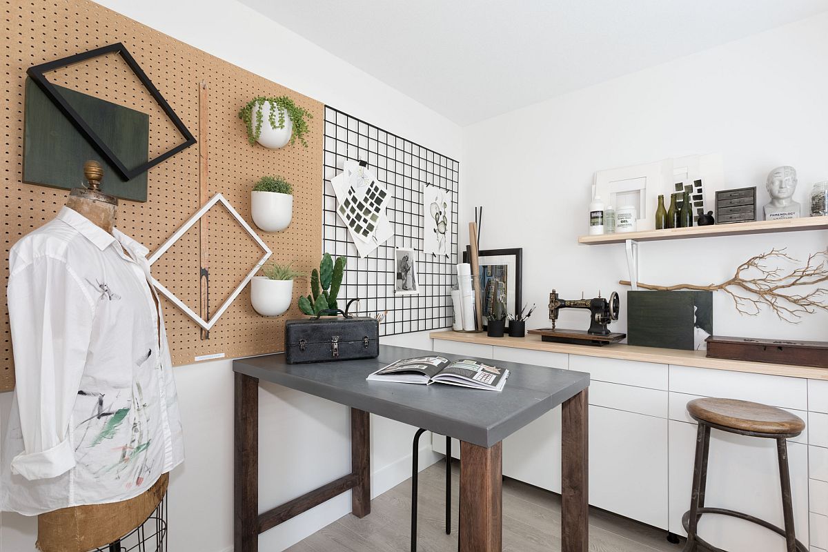 Simple grid on the wall provides easy storage solution in the white crafts room