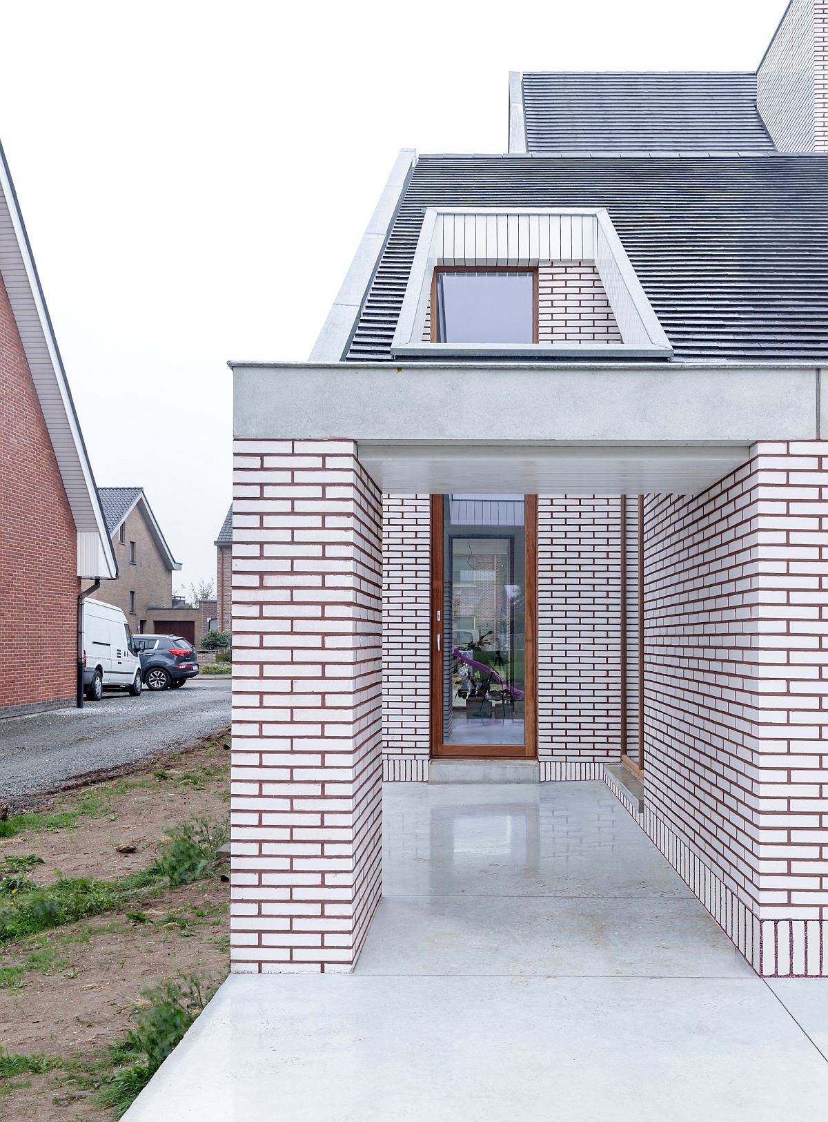 Skylight and windows bring light into the house while also shaping the custom design of the exterior