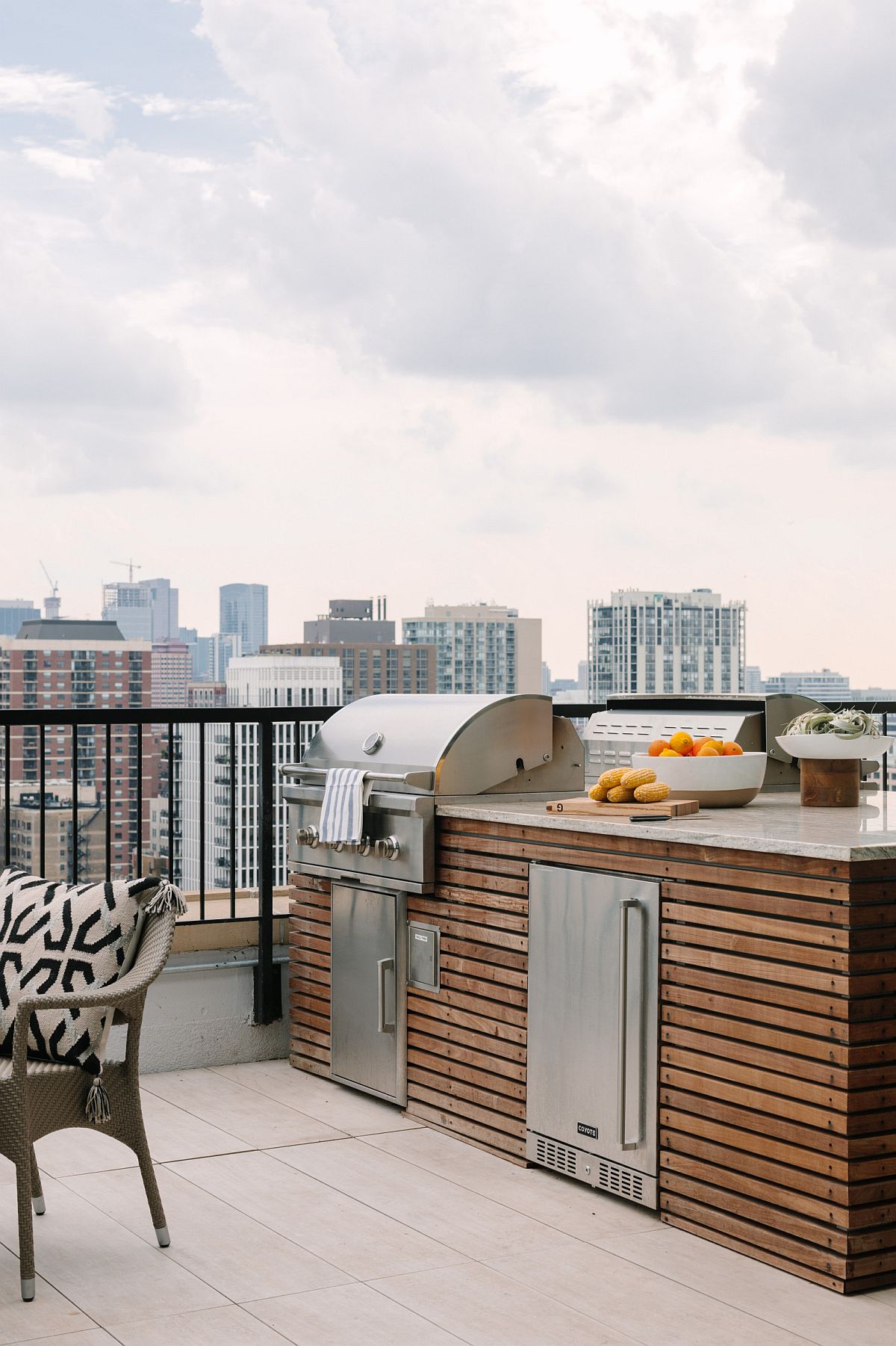 Small roooftop kitchen in the corner with space-savvy design and barbecue zone