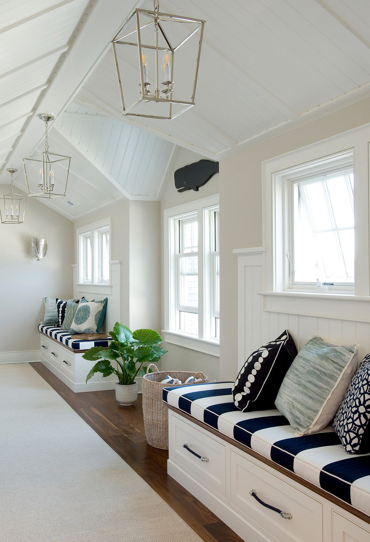 Spacious beach style hallway with custom built-in benches that offer plenty of storage space