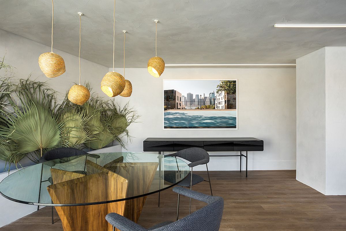 Straw pendants and dried palm leaves add natural touches to the interior of the apartment