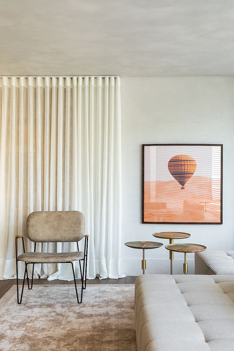 Textured walls and muted earth tones usher in modern Moroccan style inside this Brazilian apartment