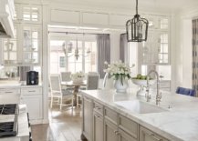 Traditional-kitchen-and-dining-are-aof-the-remodeled-home-in-white-with-gray-accents-and-drapes-41801-217x155