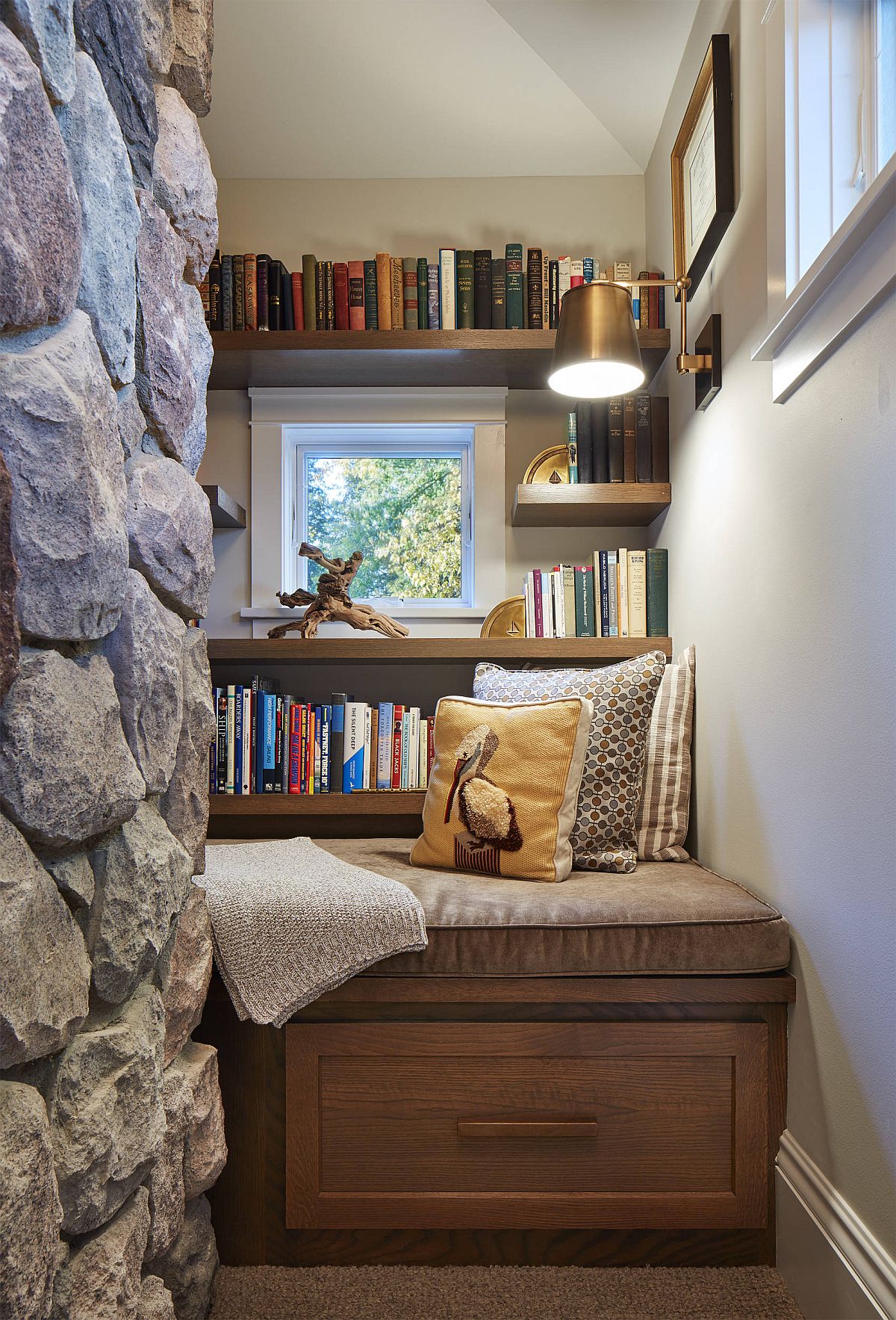 Transforming the tiny niche in your home into a small home library with custom built-in bench and open shelves