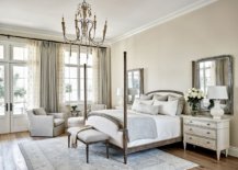 Transitional-bedroom-in-white-with-mirrors-above-the-nightstand-that-bring-symmetry-to-the-interior-19735-217x155