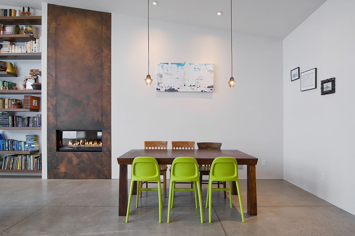 Trio of green chairs bring color to this exquisite minimal dining room