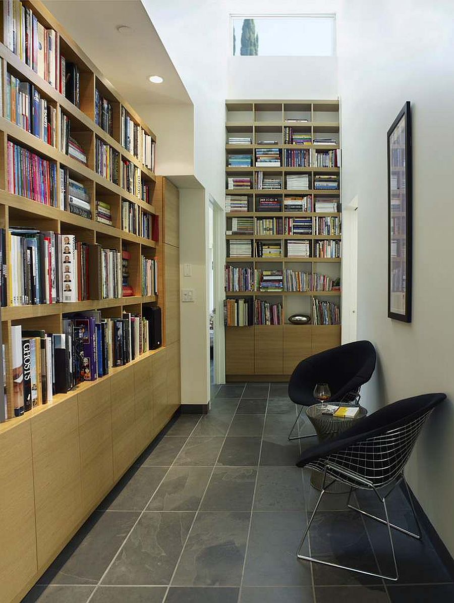 Turn the hallway into a home library and reading space with ample space for books and a couple of chairs