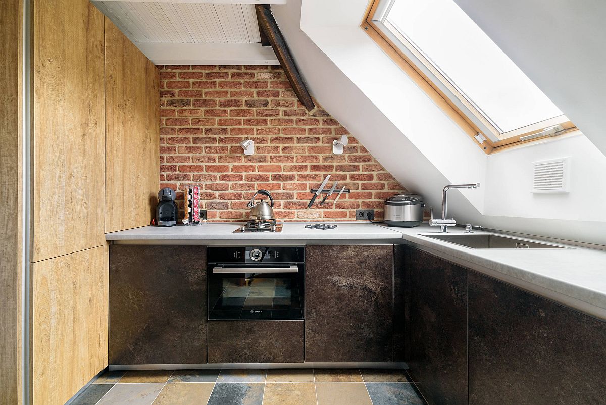 Ultra-small kitchen with a window that ushers in ample natural light and a small brick wall backsplash