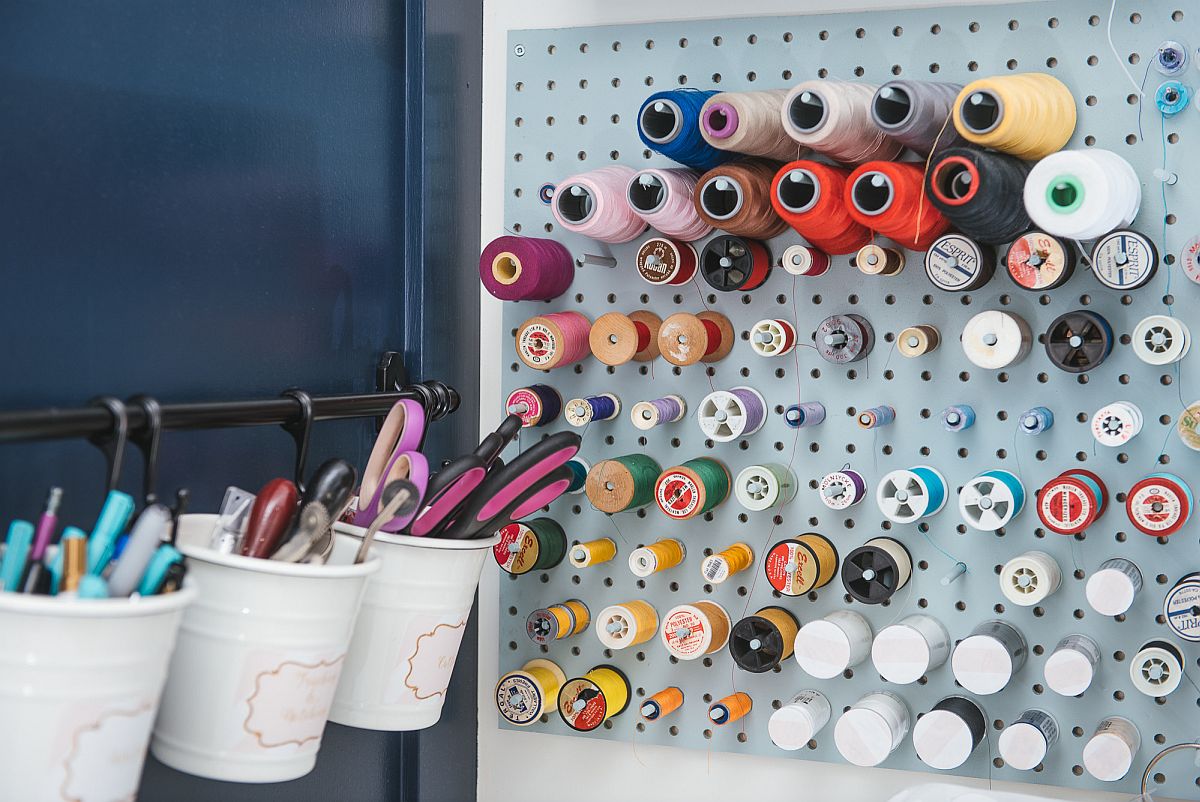 Using smart storage options like pegboards allows you to maximize wall space in the small crafts room