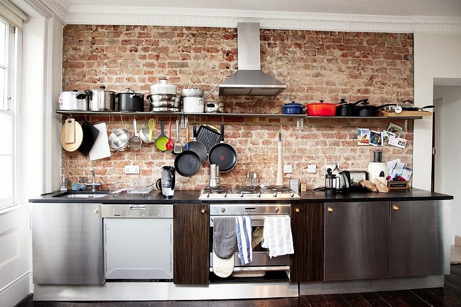 Using walls space in the small industrial kitchen with hooks, hangers and floating shelves