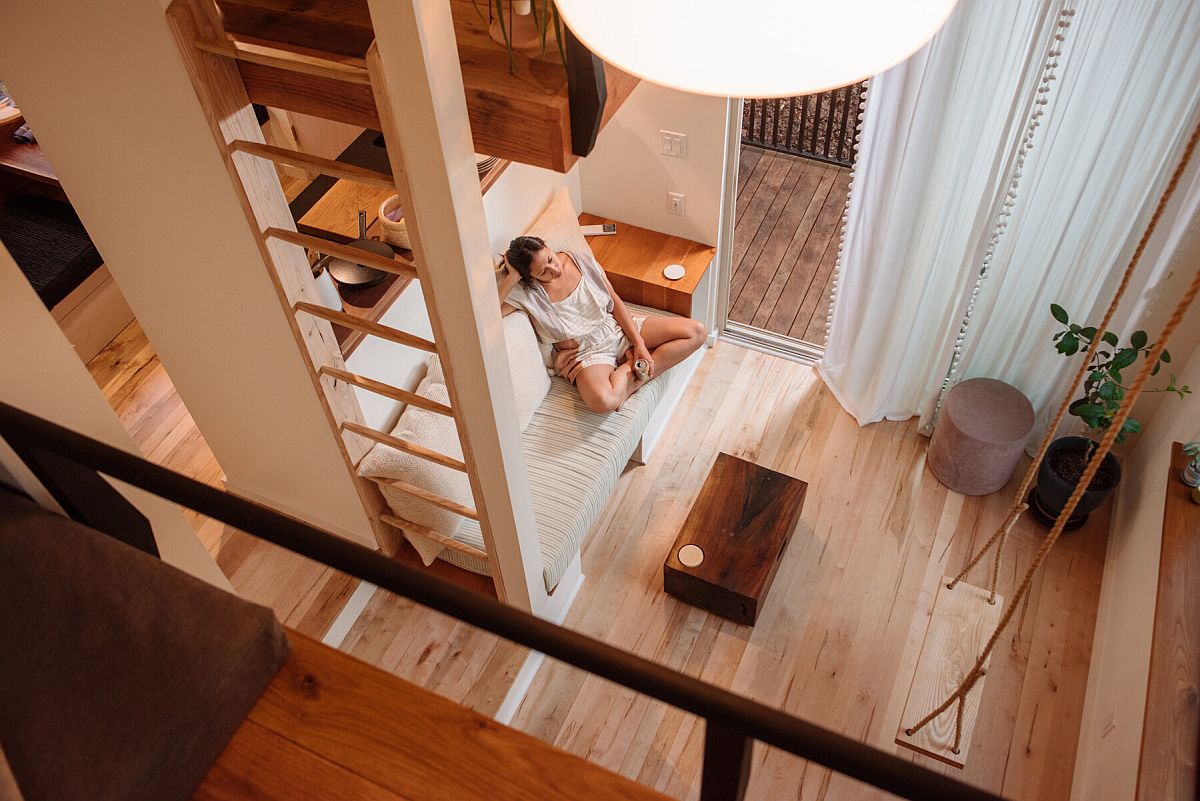 View of the small and beautiful living area of the cabin from the loft beds above