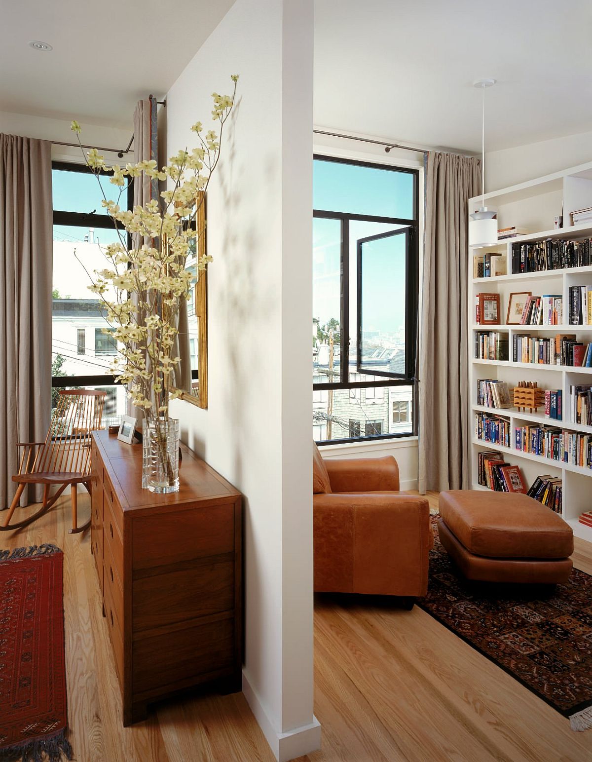 Wall partially divides the bedroom from the reading space while also creating a connectivity between the two