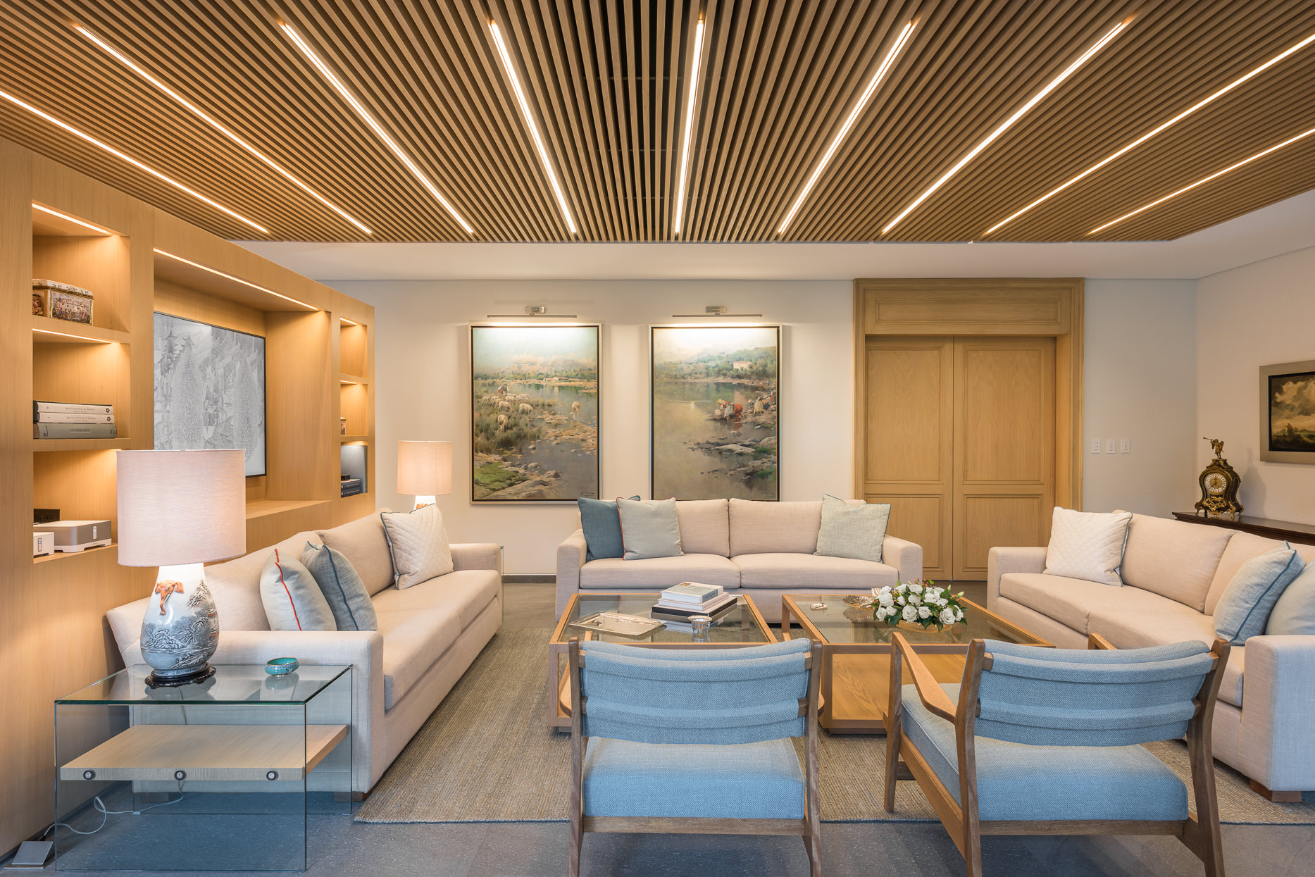 Wood and white interior of the house coupled with blue accents and lovely framed photographs