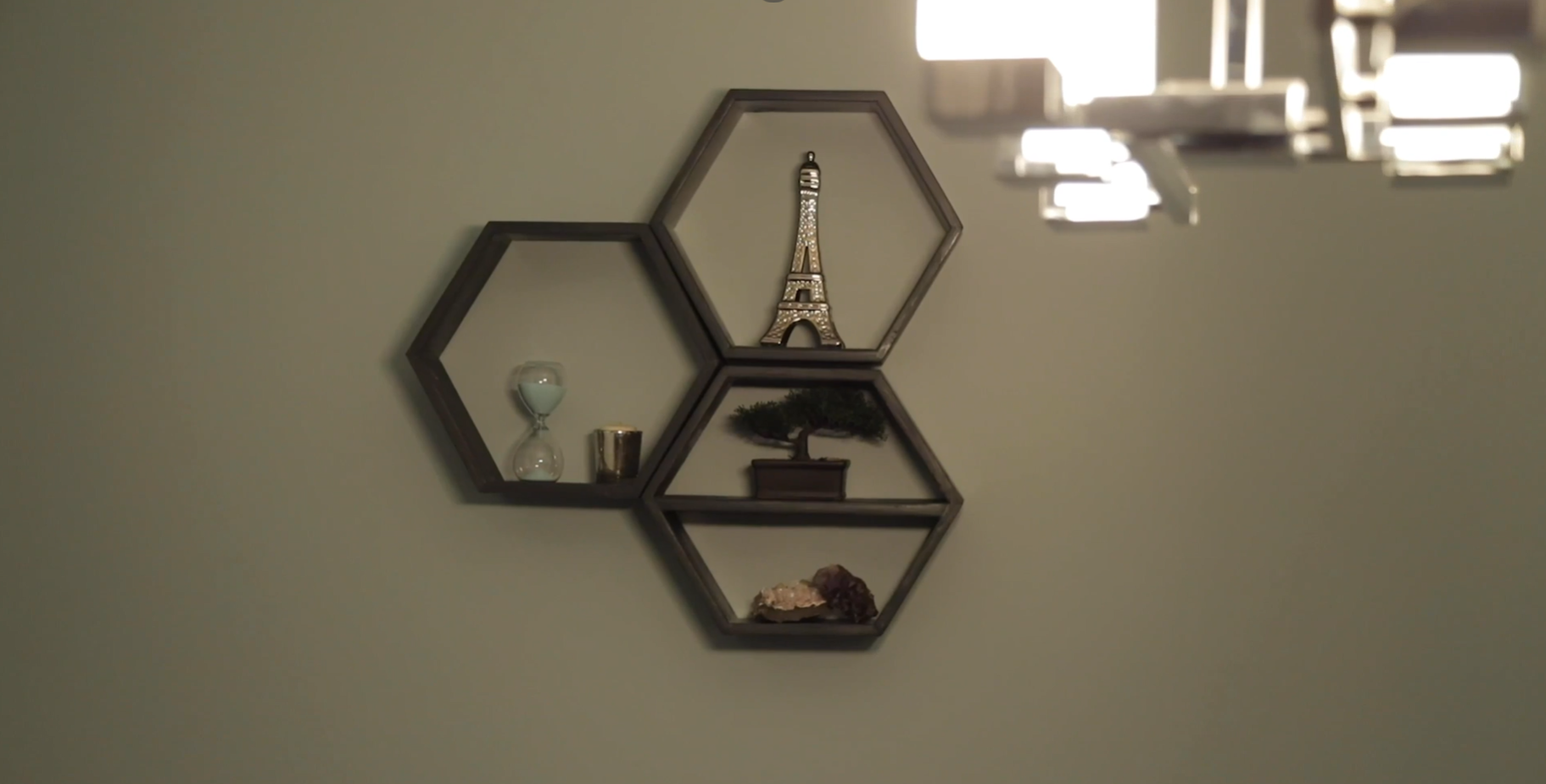 three hexagon shelves on wall