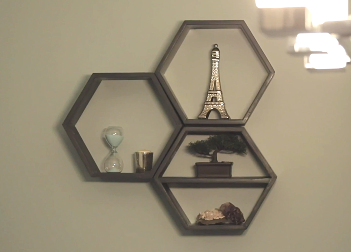 three hexagon box shelves hanging on wall