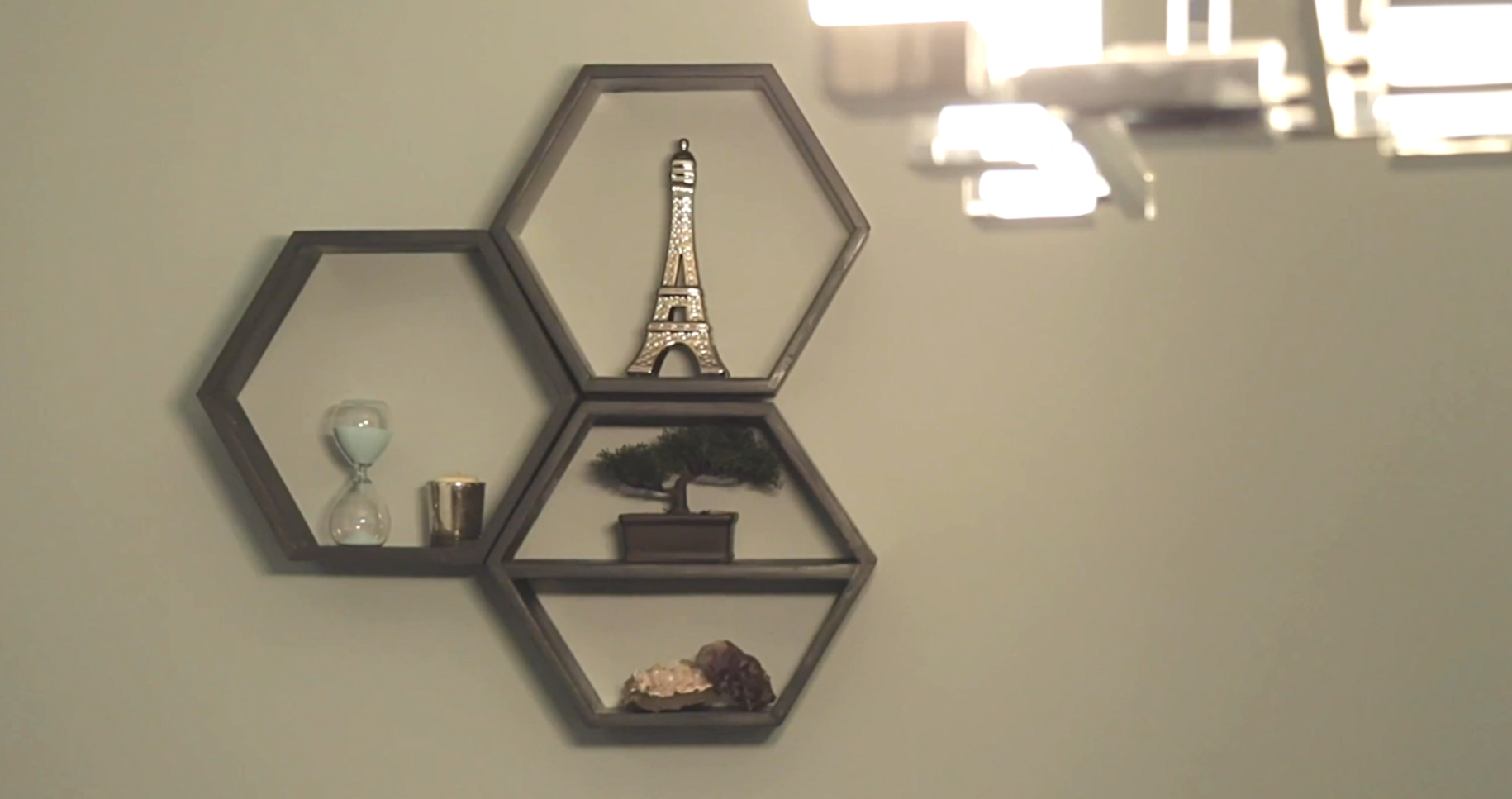 three hexagon box shelves hanging on wall