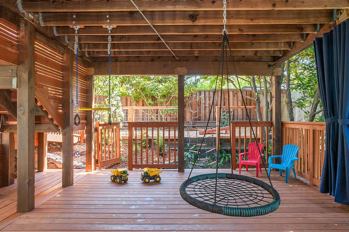 Beautiful wooden deck creates the perfect playarea for kids with shade, swings and ample space