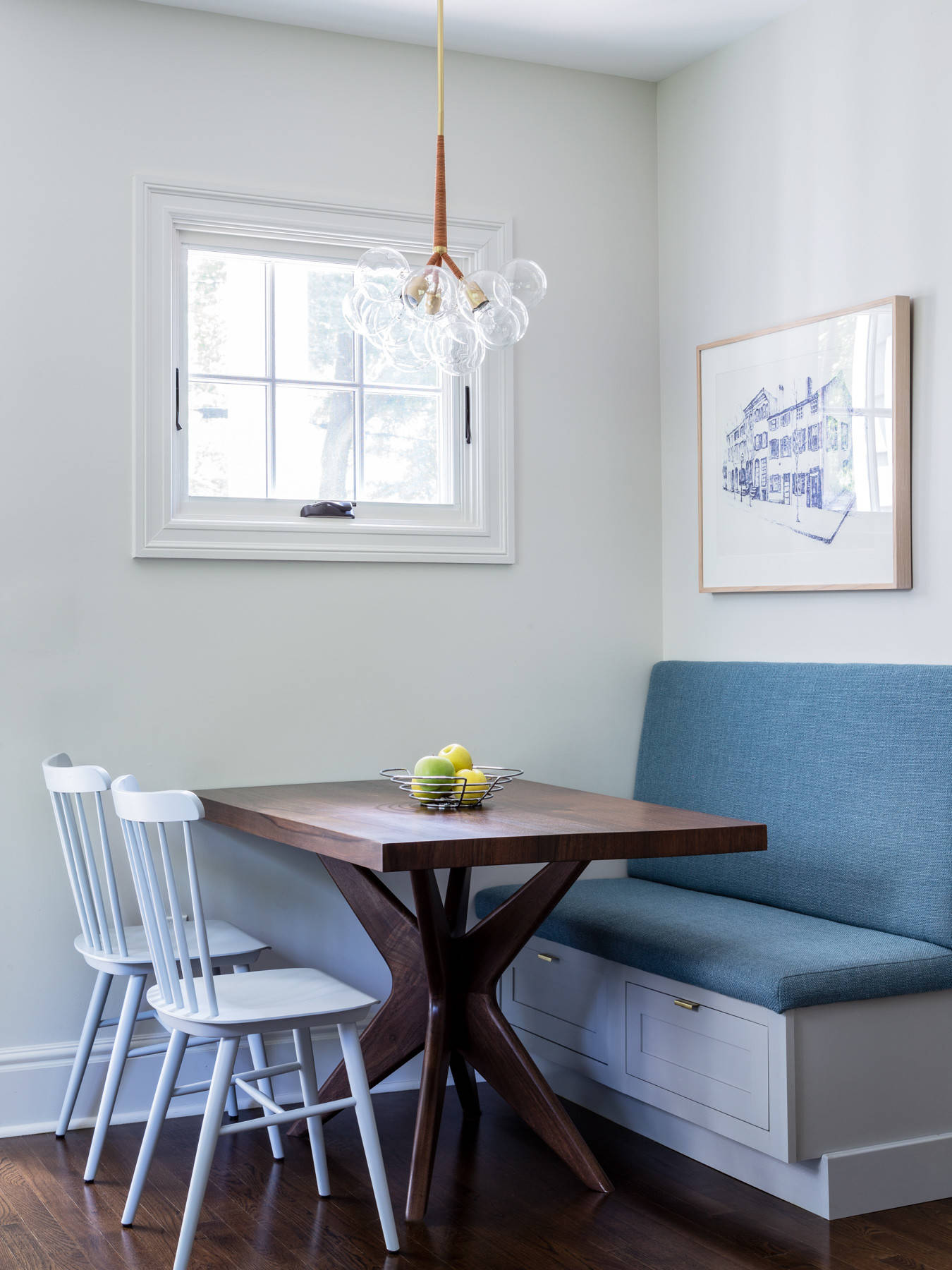 Bench in the corner for the small dining room also offers clever storage space