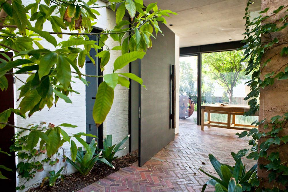 Brick floor works brilliantly in the contemporary entryway as well