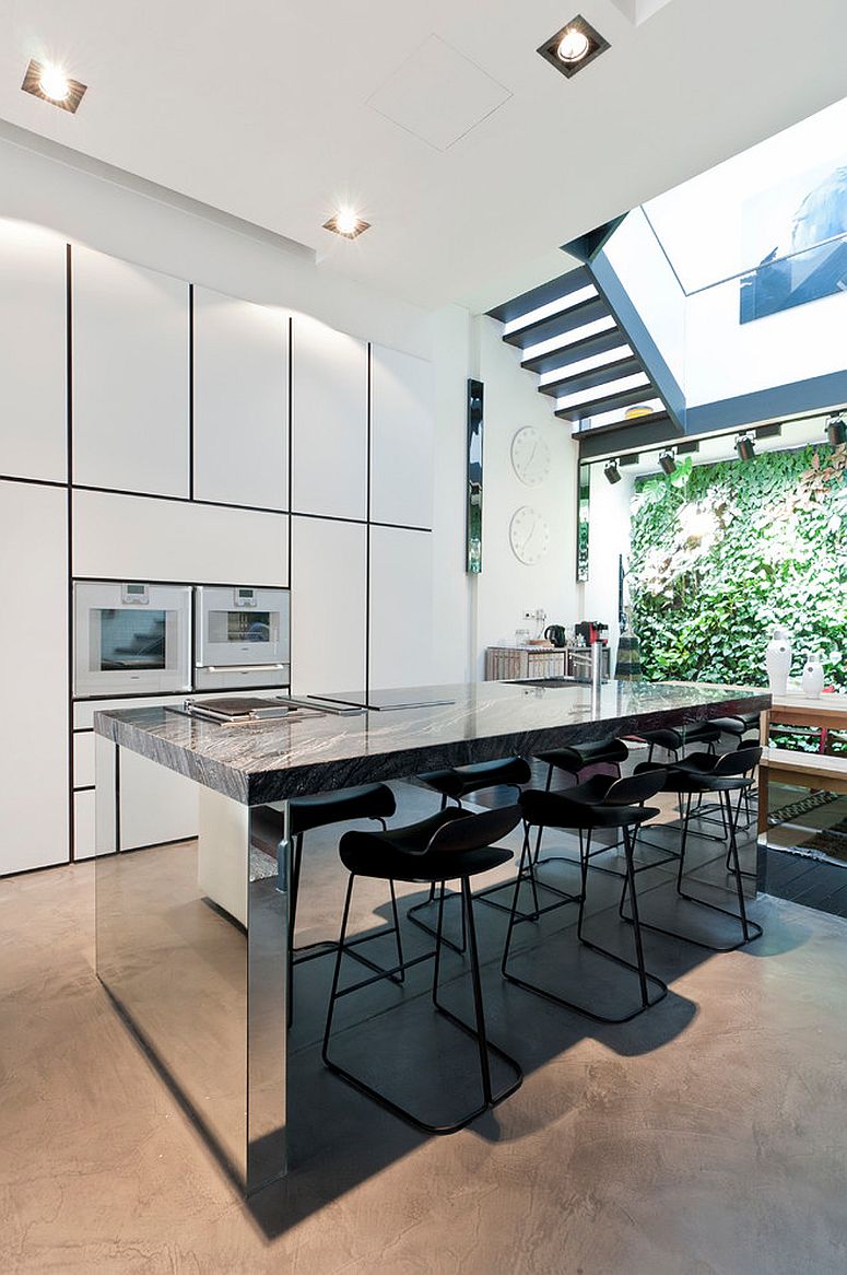 Combine natural stone countertops with mirrored finishes for a stylish contemporary kitchen island