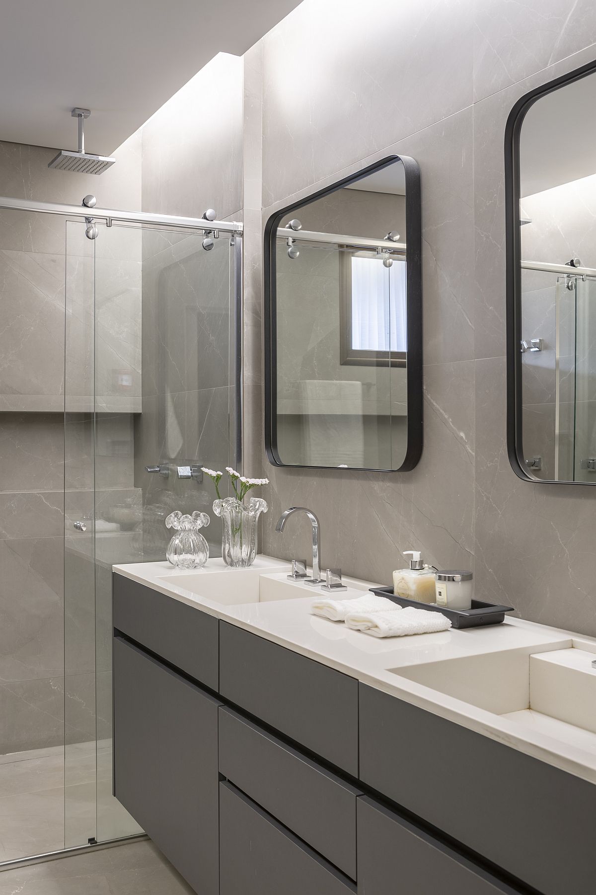 Contemporary bathroom in gray with twin mirrors and vanities